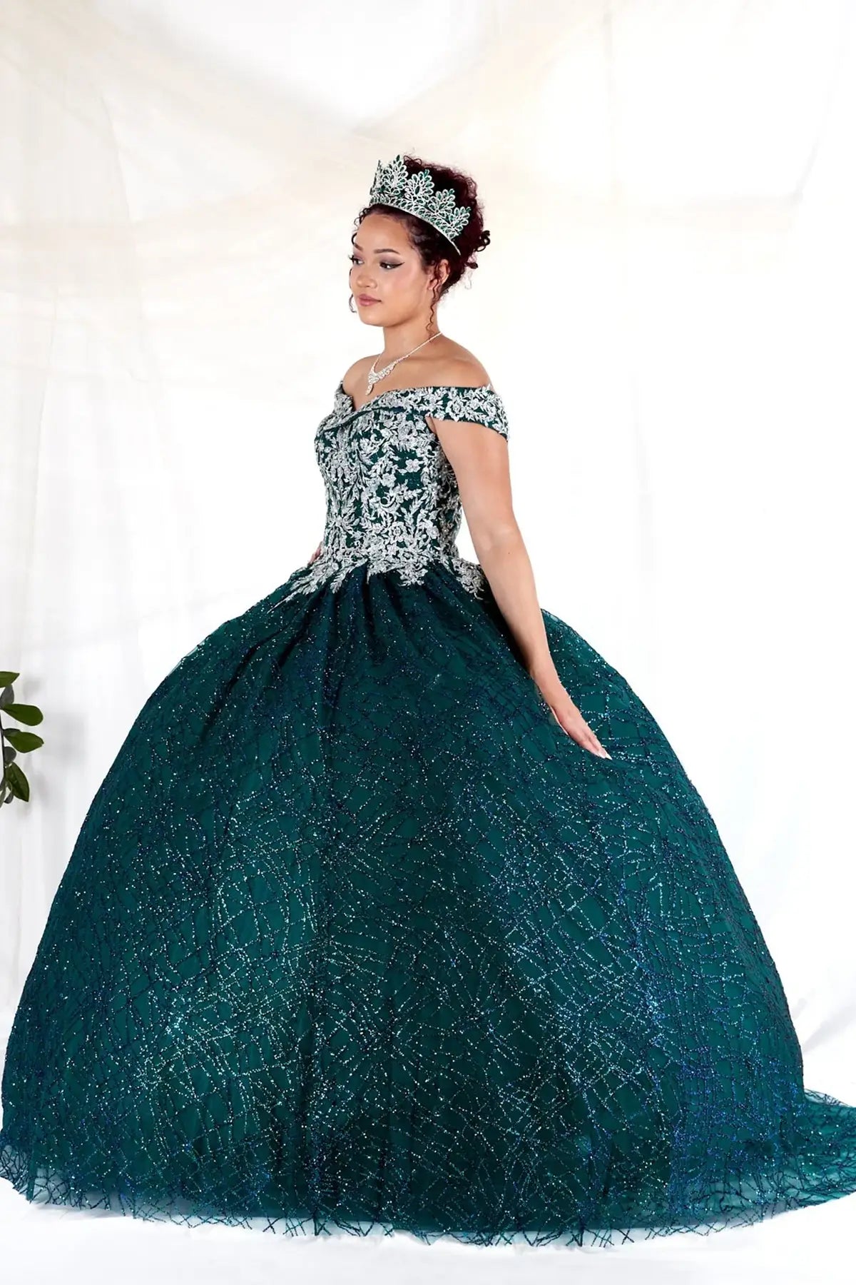 Emerald green quinceañera ball gown with glitter sequins, sparkling bodice and layered tulle skirt
