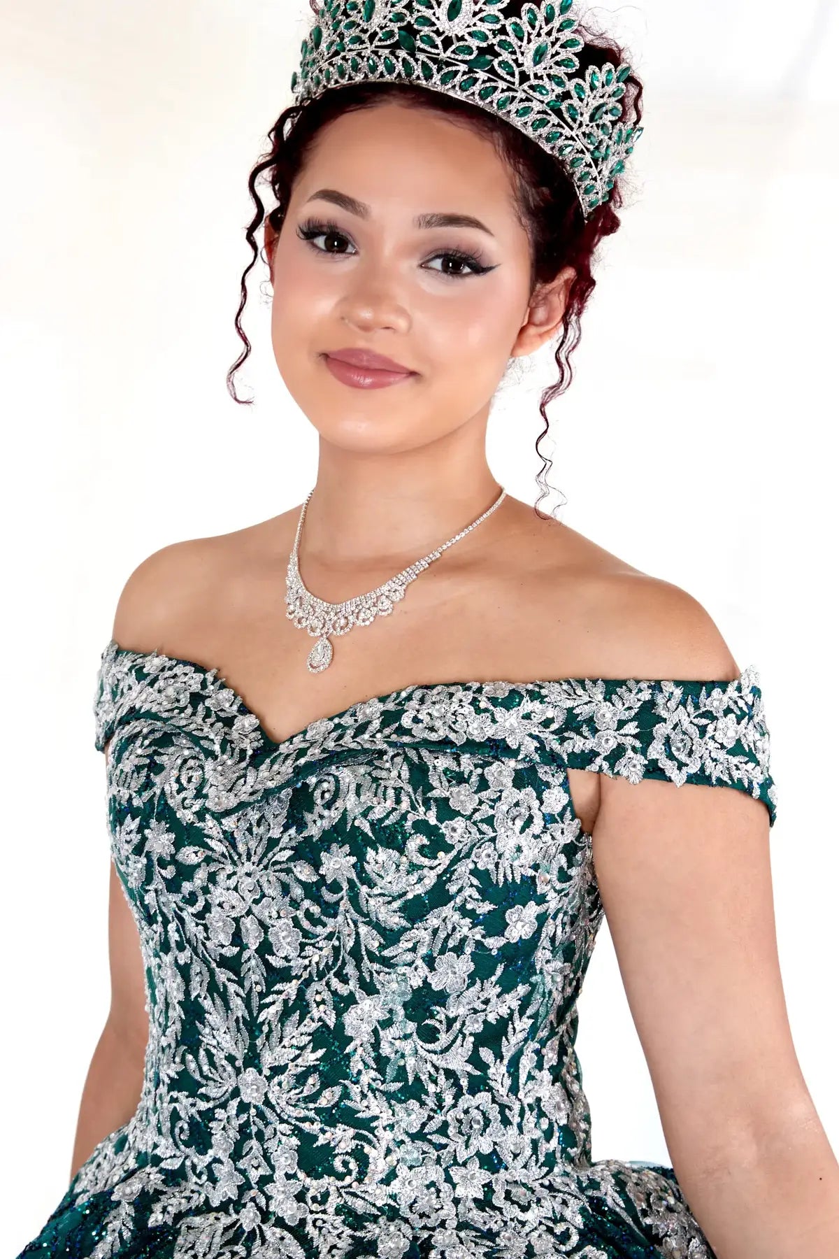 Emerald green quinceañera ball gown with glitter sequins, sparkling bodice and layered tulle skirt