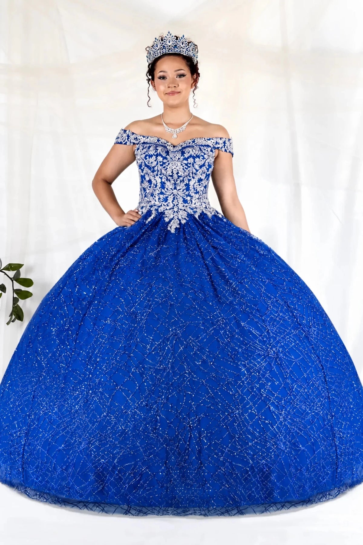 Royal blue quinceañera ball gown with glitter sequins, sparkling bodice and layered tulle skirt