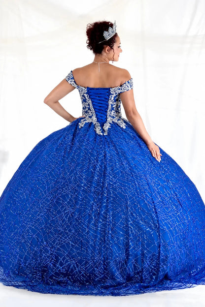 Close-up view reveals royal blue quinceañera ball gown with glitter sequins, sparkling bodice and layered tulle skirt.