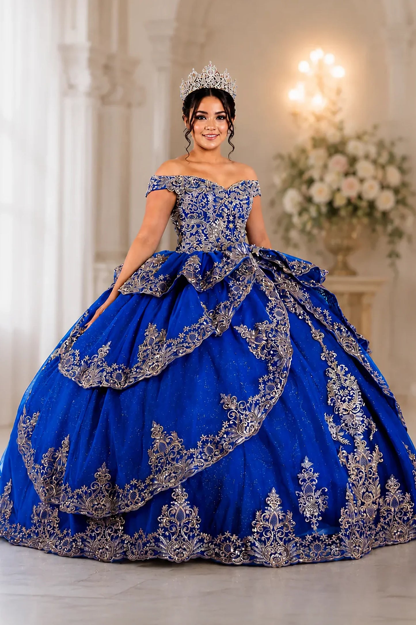 elaborate royal blue off-the-shoulder quinceanera ball gown with ornate silver embroidery