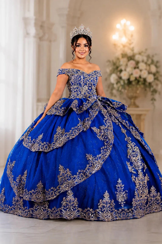 Skirt detail shows royal blue quinceañera ball gown with ornate silver embroidery and layered skirt.