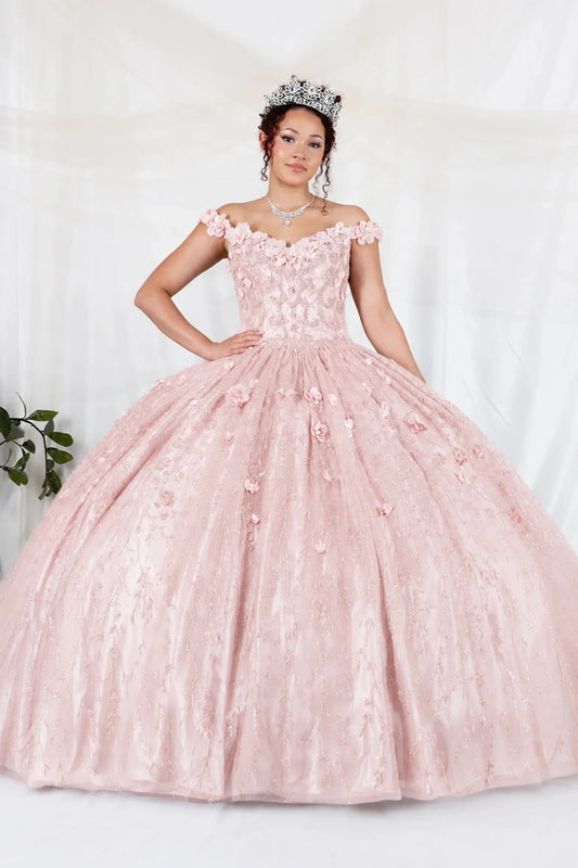 Bodice close-up highlights blush quinceañera ball gown with off‑shoulder neckline, delicate floral applique and flowing skirt.