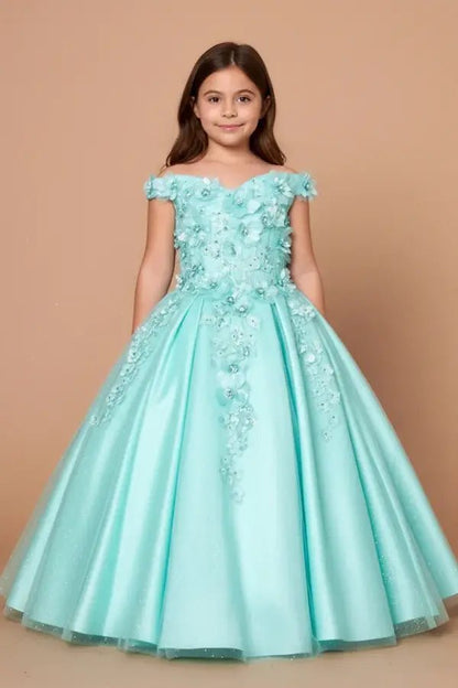 Kid standing front-facing in stunning aqua mint ball gown with 3D floral appliqué bodice, glitter accents, and layered tulle skirt