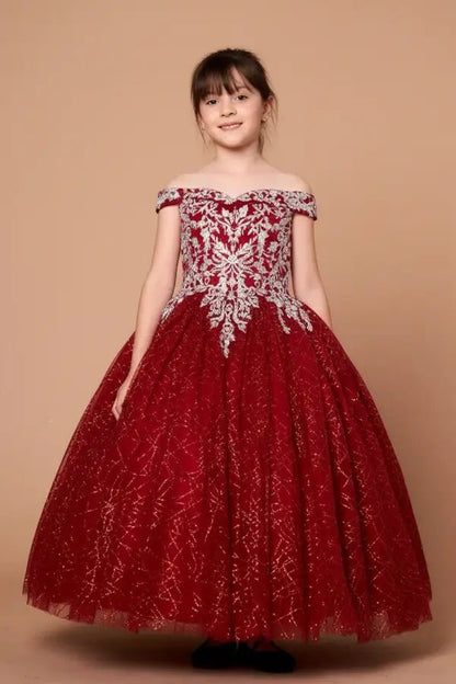 Kid standing front-facing in elegant burgundy ball gown with shiny tulle full skirt and off-shoulder neckline