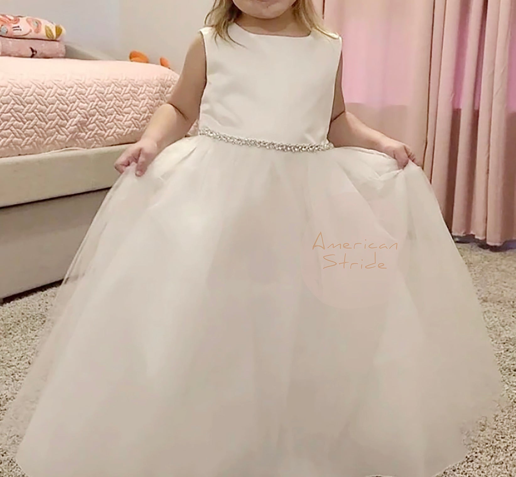 USA Made | Dainty Rhinestone Flower Girl Dress | Classic Satin and Tulle Flower Girl Dress | Size 6M - Teen - girl wearing dress holding skirt with both hands