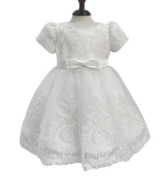 White lace dress on a mannequin against a white background
