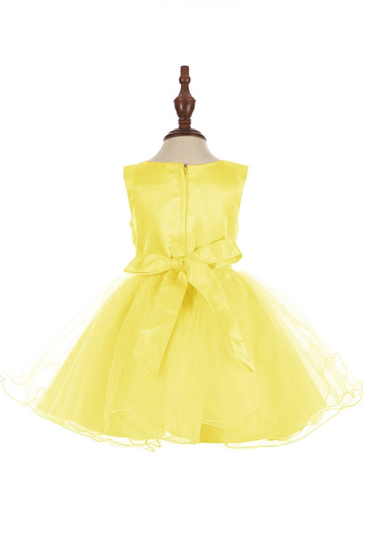 Yellow dress on a mannequin against a white background